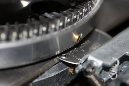 What is a metal tag embossing machine?